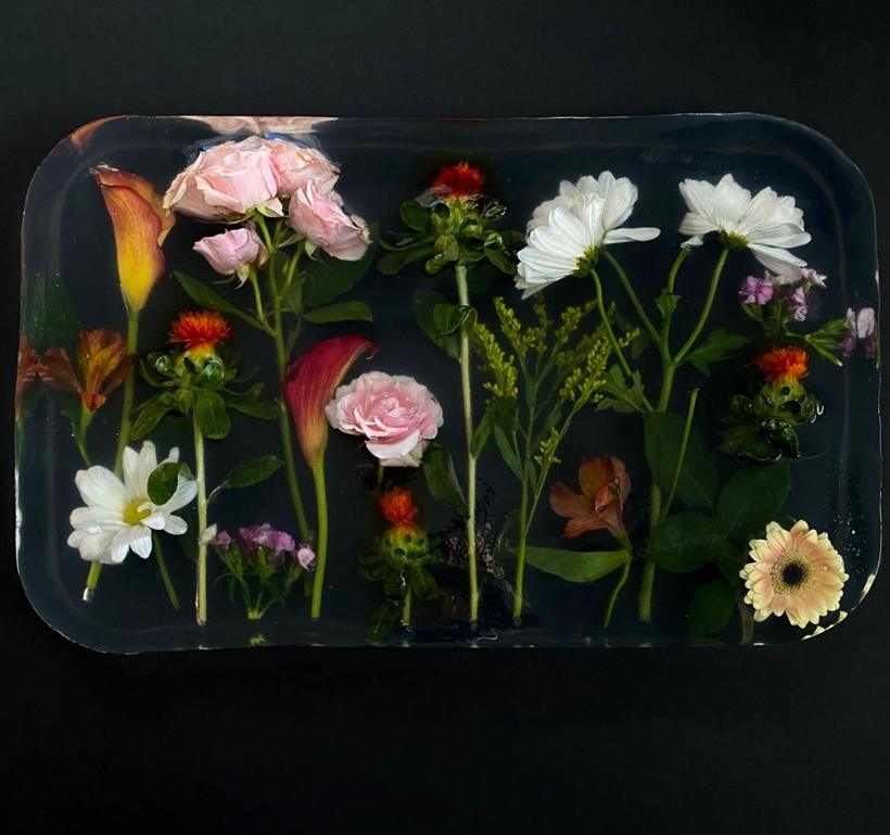 Fresh flowers set in a clear resin tray